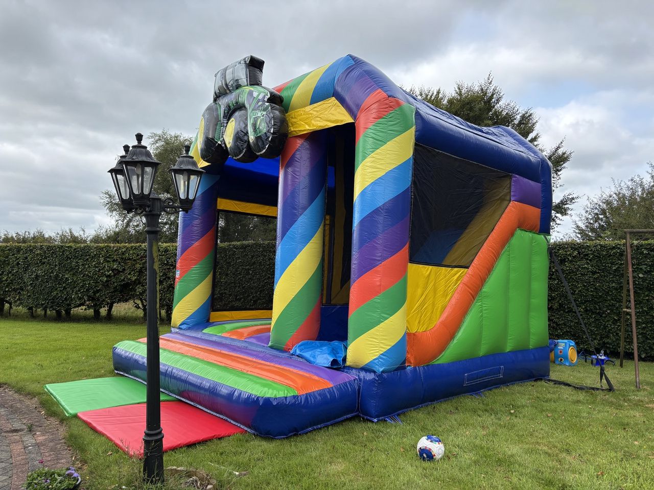 Tractor Combi bouncy castle with 7ft slide photo 2