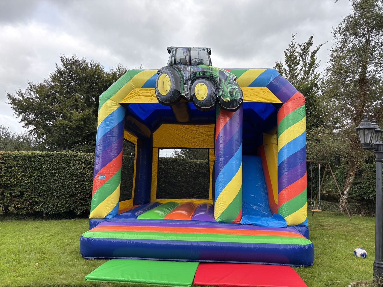 Tractor Combi bouncy castle with 7ft slide photo 3